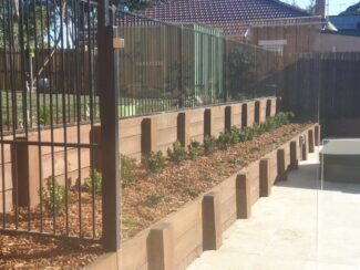 Timber retaining walls built and maintained by AGC Landscapes in the Gold Coast, QLD